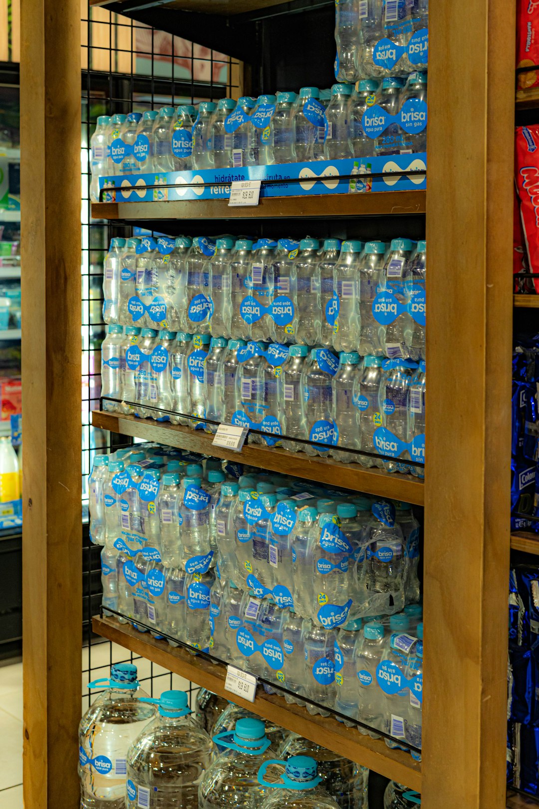 About a-large-display-of-bottled-water-in-a-store-abhfgoachu0